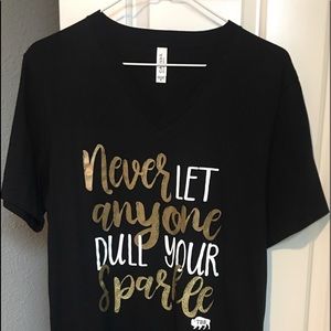Bella Canvas brand, size medium t-shirt, “Never Let Anyone Dull Your Sparkle”